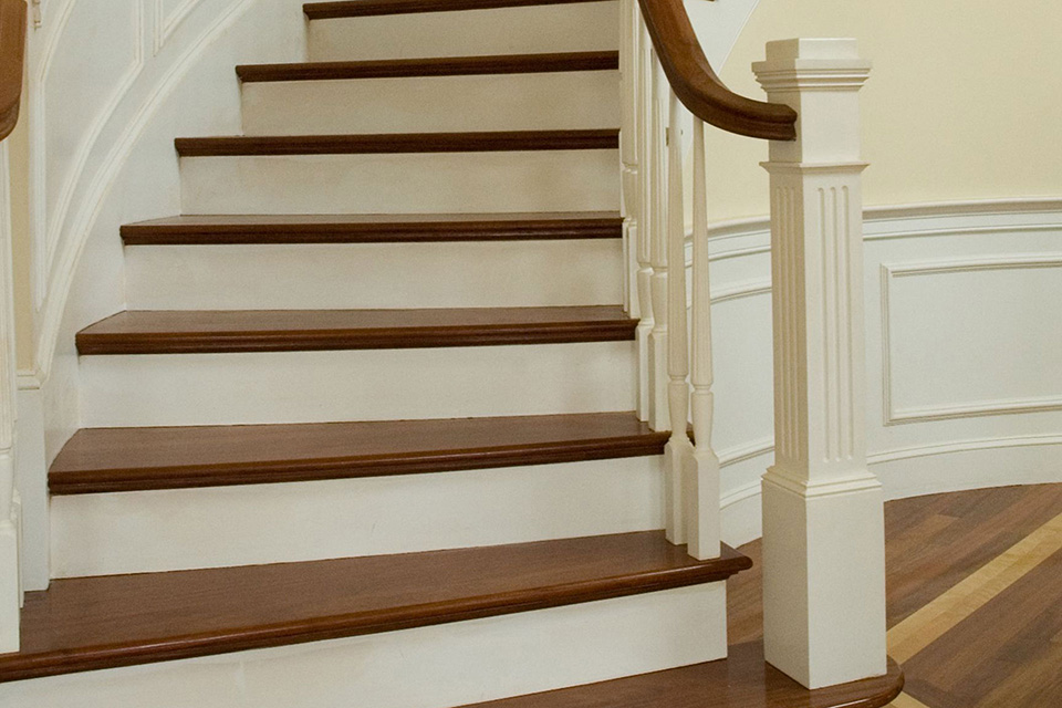 detail of curved staircase showing custom woodworking